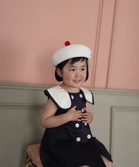 white beret with red pompom