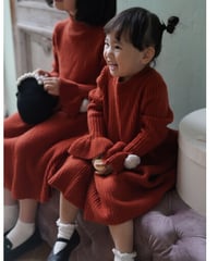 Knitted red dresses with pompom