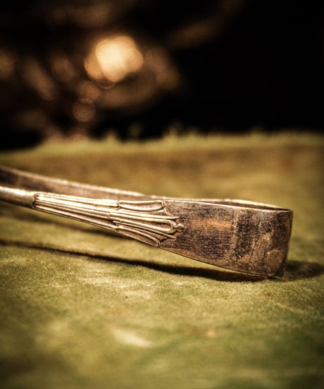 Antique bird claw tongs