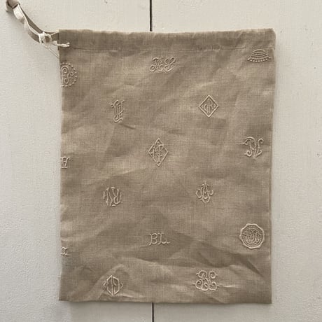 オールドマンズテーラー MONOGRAM EMBROIDERY DRAWSTRING BAG Sサイズ