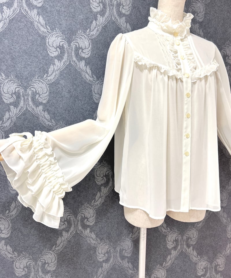 Enchantlic Enchantilly／シャンテリーフリルブラウス（生成り） | cho