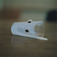 EYES・Lying small glass・White liquid（framed）