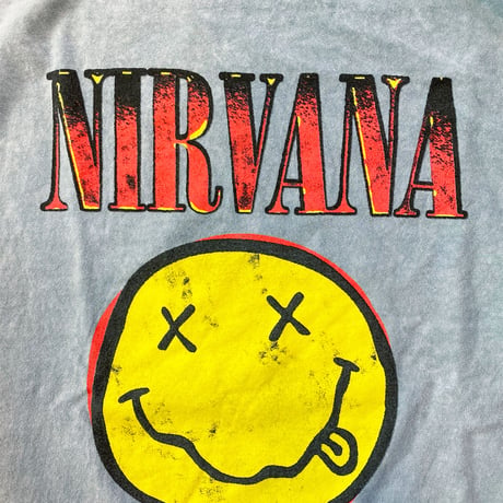 ニルヴァーナ・スマイル ロゴ・Tシャツ (ヘザーインディゴ) (U.S.A. 中古衣料品)