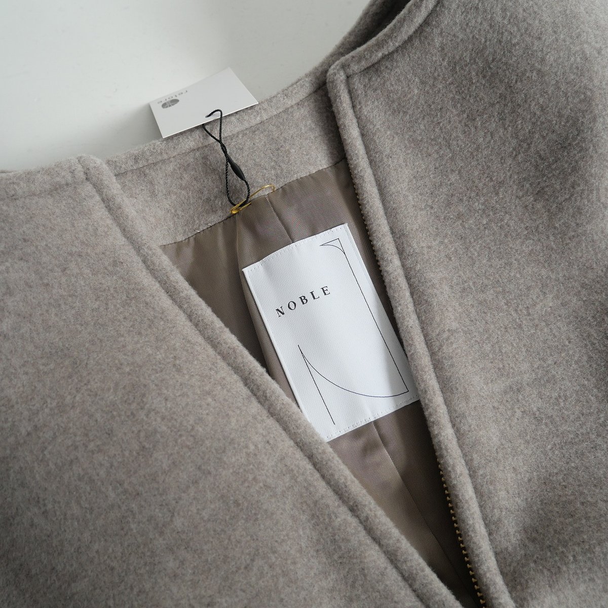 NOBLE MTRカラーレスジップショートコート Noble（ノーブル）の「MTRカラーレスジップショートコート