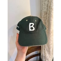 dark green cap
