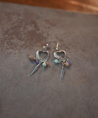 Subtle "Navajo heartfull feather pierce"