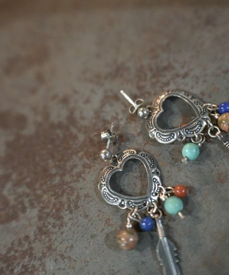 Subtle "Navajo heartfull feather pierce"