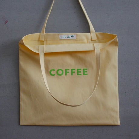 cafe shimaのオリジナルのカバン　黄色生地　×  グリーンロゴ文字