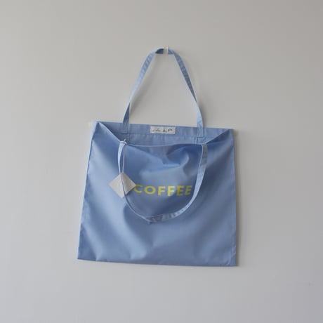 cafe shimaのオリジナルのカバン　  水色生地×黄色ロゴ文字