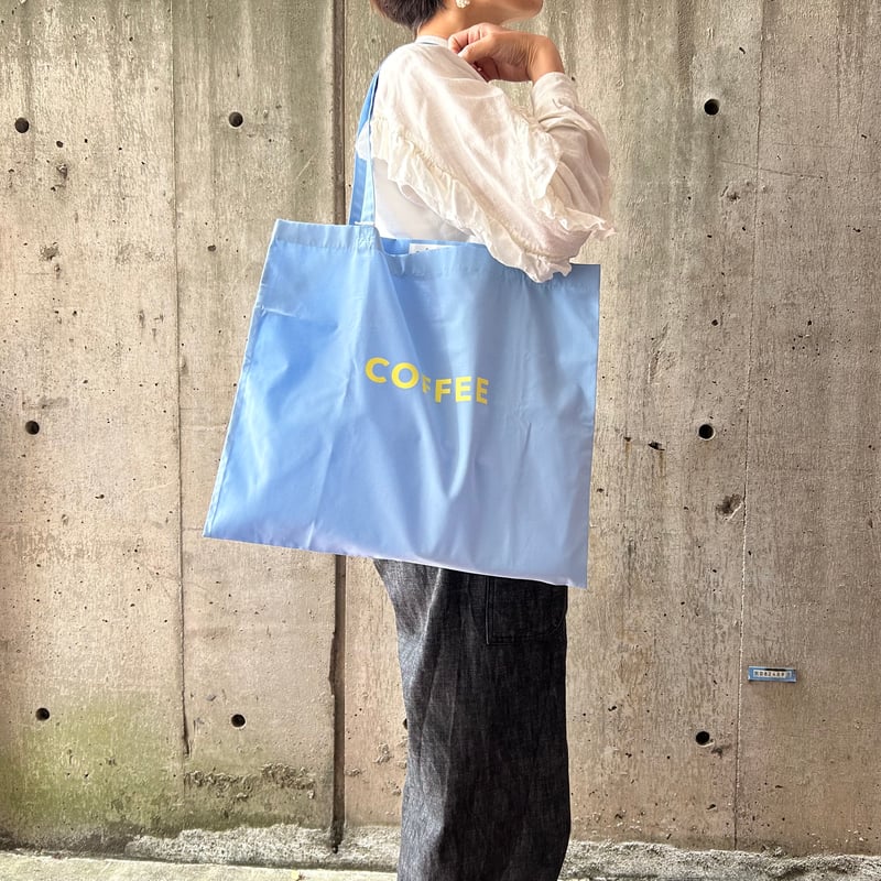 cafe shimaのオリジナルのカバン 水色生地×黄色ロゴ文字 | cafe