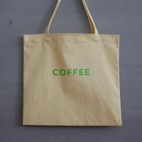 cafe shimaのオリジナルのカバン　黄色生地　×  グリーンロゴ文字