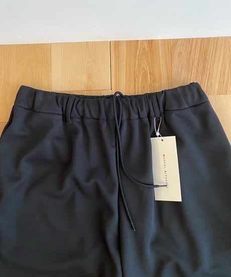 MANUAL ALPHABET マニュアルアルファベット（ユニセックス）/ SMOOTH JERSEY WIDE TRUCK PANTS スムースジャージートラックワイドパンツ【ブラック】