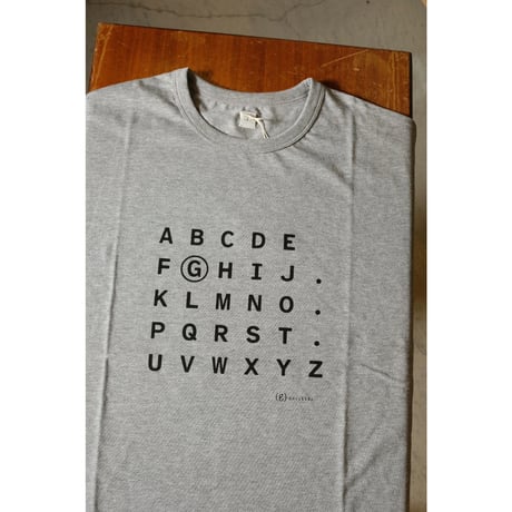 (g) グラム "TENJIKU PRINT Tee  ALPHABET"