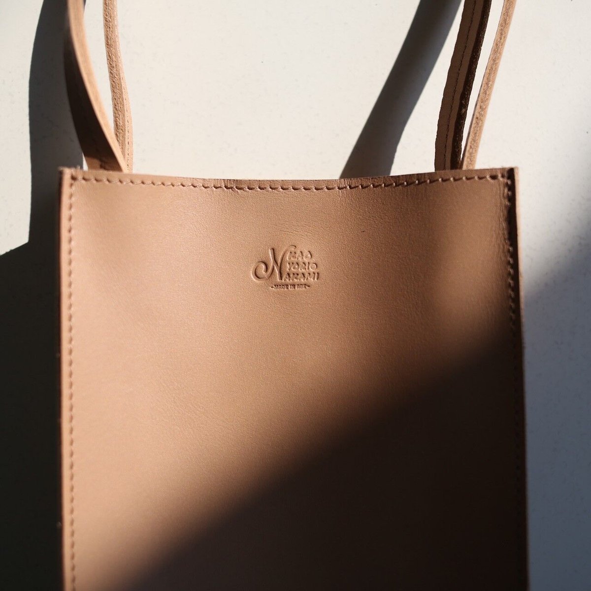 logo leather pochette | kaoyorinakami logo leather pochette | kaoyorinakami