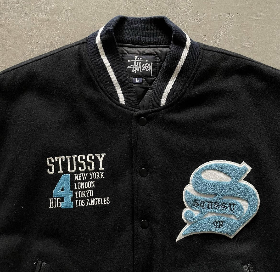 90s Stussy ”Big 4” varsity jacket | sui & shara 90s Stussy ”Big 4” varsity jacket | sui & shara