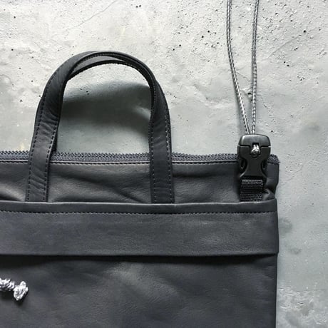 OUT LEATHER MINIMUM BAG