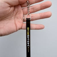 黒と黄色と白のキーホルダー