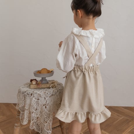 Frill suspender skirt / tweed milk