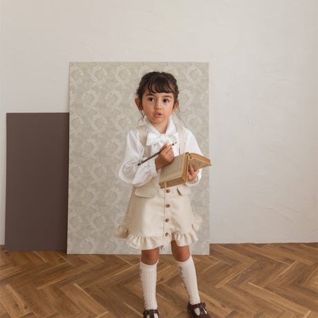 Frill suspender skirt / tweed milk