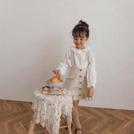 Frill suspender skirt / tweed milk