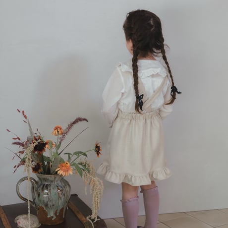Frill suspender skirt / tweed milk