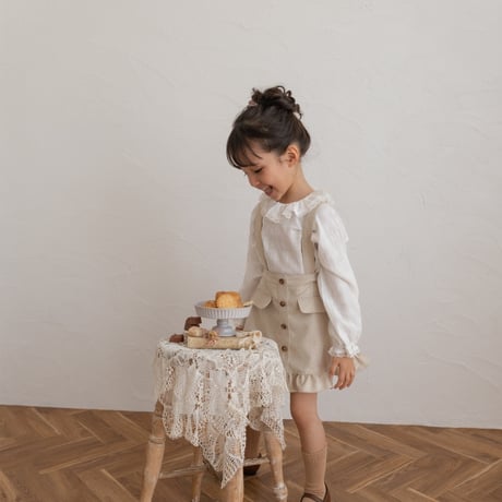 Frill suspender skirt / tweed milk
