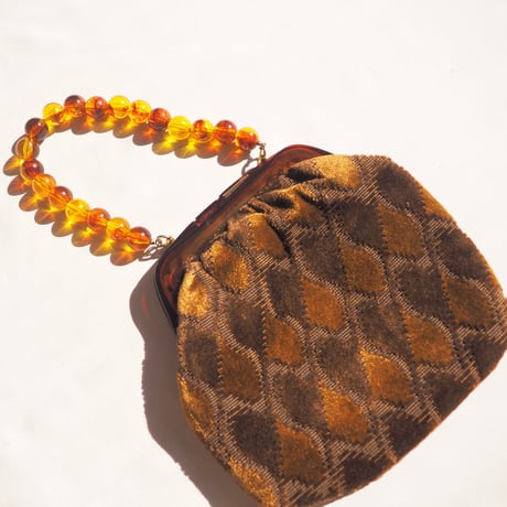 80s amber beads × velvet bag