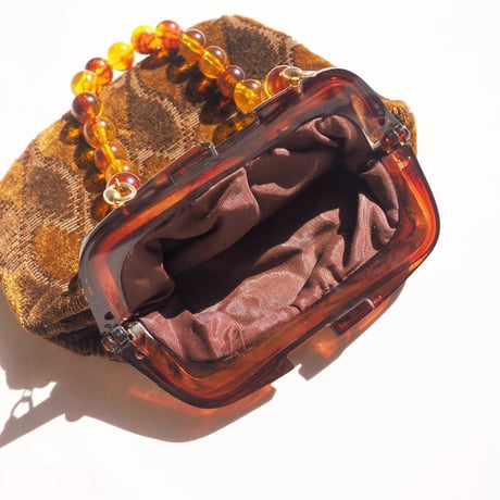 80s amber beads × velvet bag