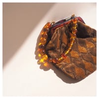 80s amber beads × velvet bag