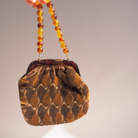 80s amber beads × velvet bag