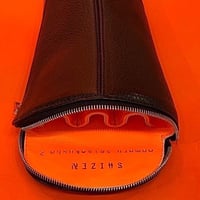 Black leather lined with neon orange leather