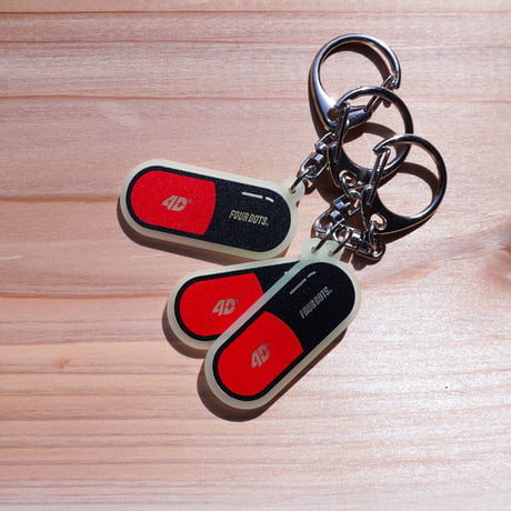 Capsule key chain MINI “KND”