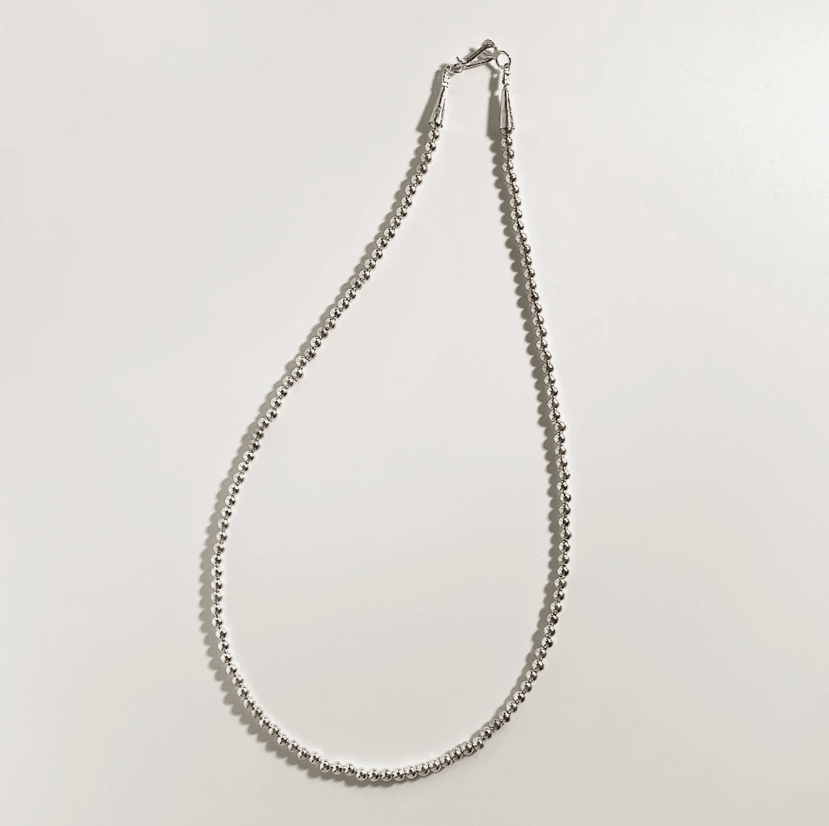 ERICKA NICOLAS BEGAY【5mm/60cm Shiny navajo pear ERICKA NICOLAS BEGAY【5mm/60cm Shiny navajo pear