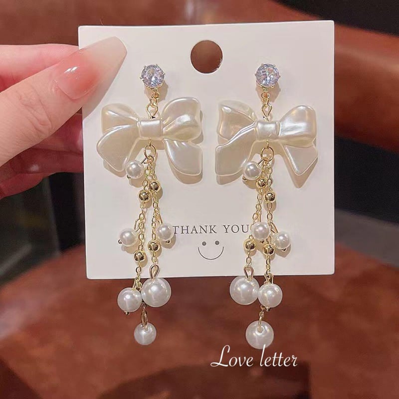 量産型ホワイトリボンパールビジューピアス イヤリング | Love letter