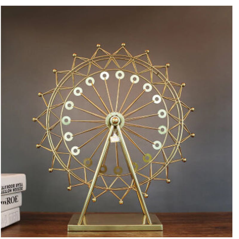 金色の円形デザインのオブジェ 移れ 