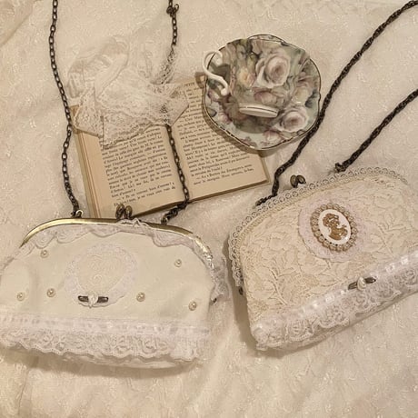Lace cameo clasp bag