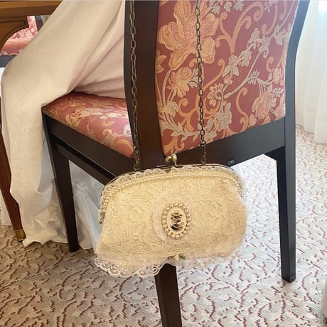 Lace cameo clasp bag