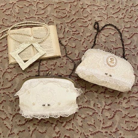 Lace cameo clasp bag