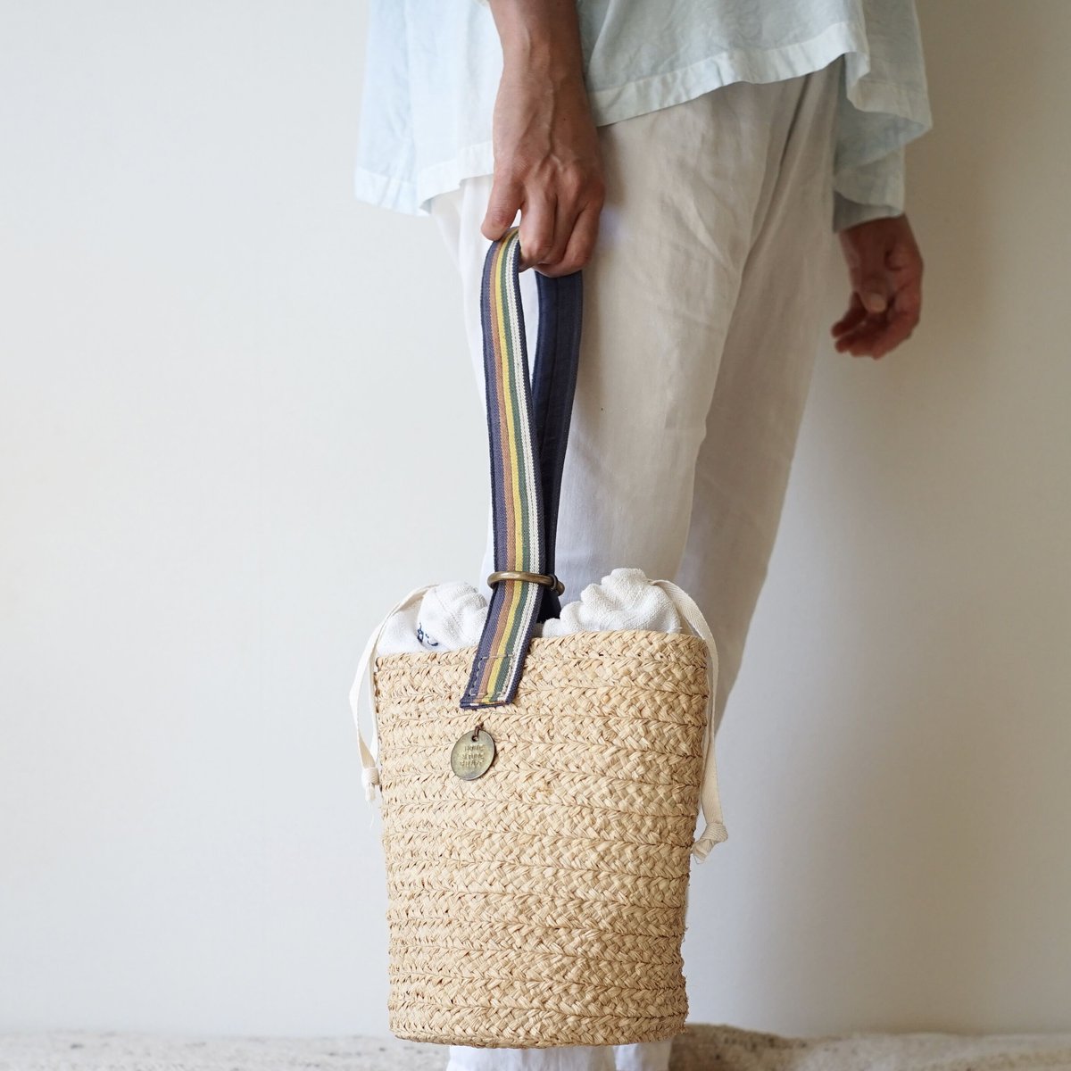 Raffia basket one handle bag with antique linen Raffia basket one handle bag with antique linen