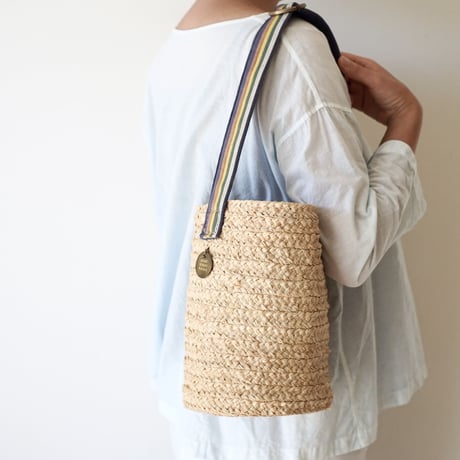 Raffia basket one handle bag with antique linen