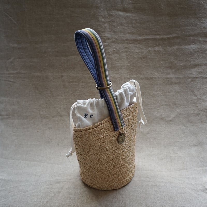 Raffia basket one handle bag with antique linen