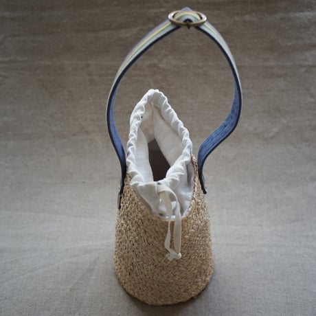 Raffia basket one handle bag with antique linen