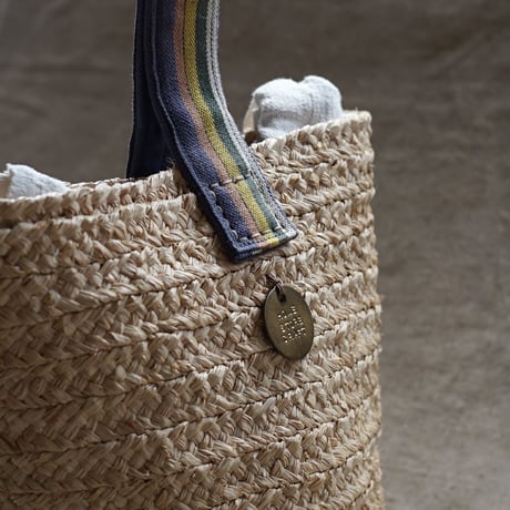 Raffia basket one handle bag with antique linen
