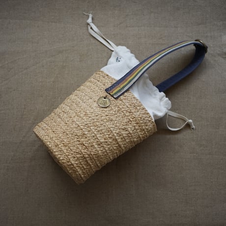 Raffia basket one handle bag with antique linen