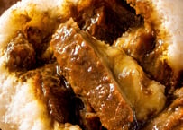 カレー角煮まん4個入（2026年7月末終売予定）