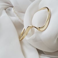 Wave gold bangle