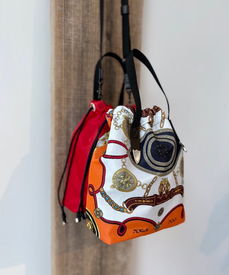 TOGA TOO/Print drawstring bag/ORANGE | pain