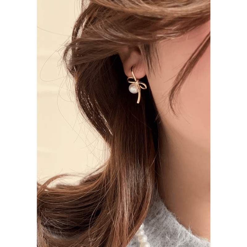 【Rita Monica】Ribbon Pearl Earrings ピアス☆韓国発 ribbon pearl ピアス イヤリング 2カラー | Cattlya