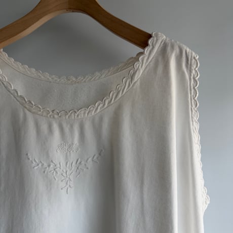 white cotton sleeveless one-piece