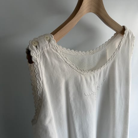 white cotton sleeveless one-piece